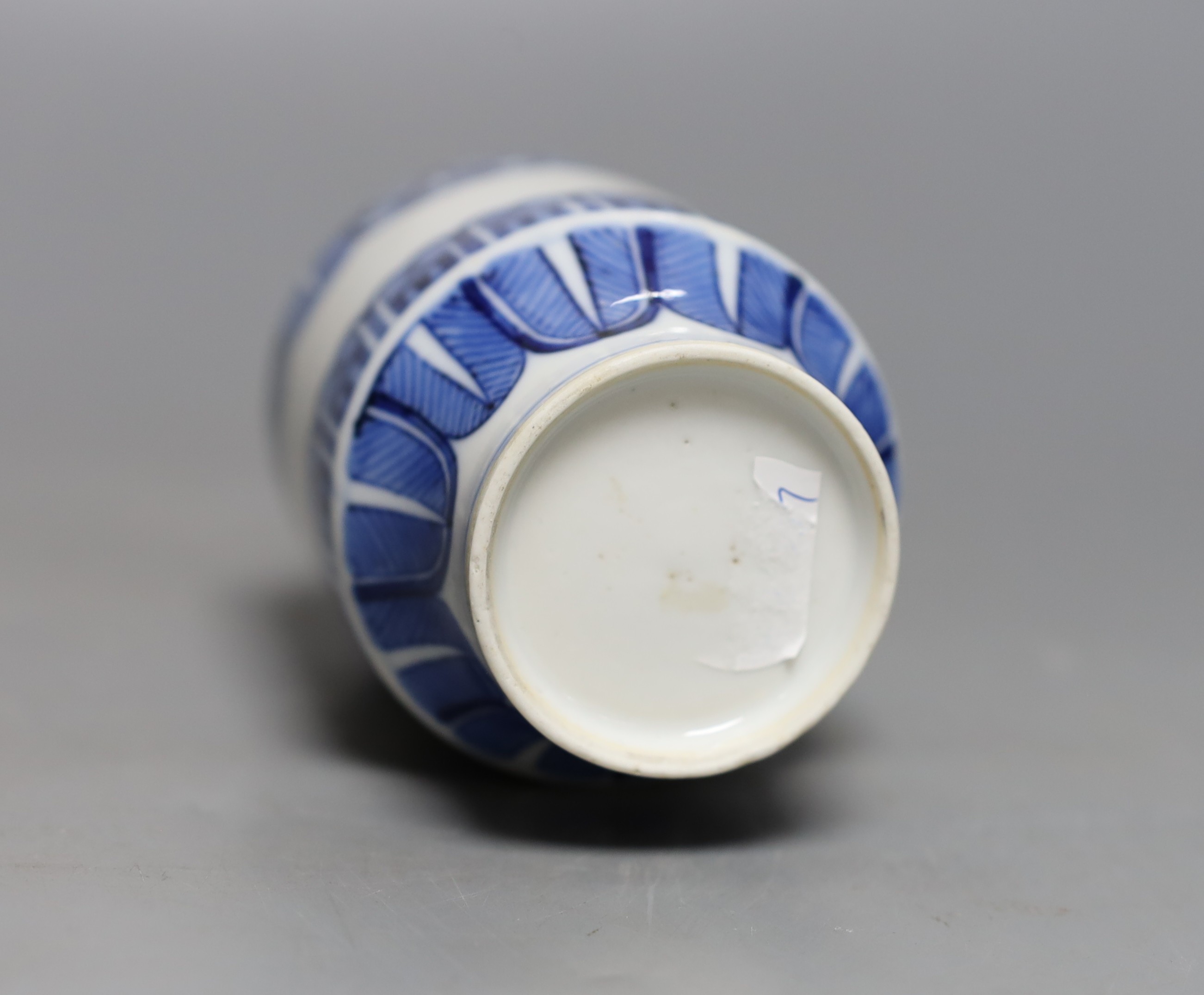 A Japanese blue and white vase, two similar dishes and a tea bowl and saucer